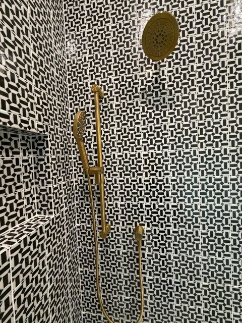 Elevated hardware in gold is the perfect contrast and gives a warm and pleasing contrast to the tile pattern.
