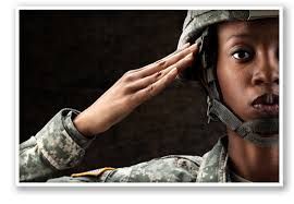 A woman in a military uniform is saluting.