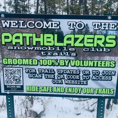 A sign that says welcome to the pathblazers snowmobile club