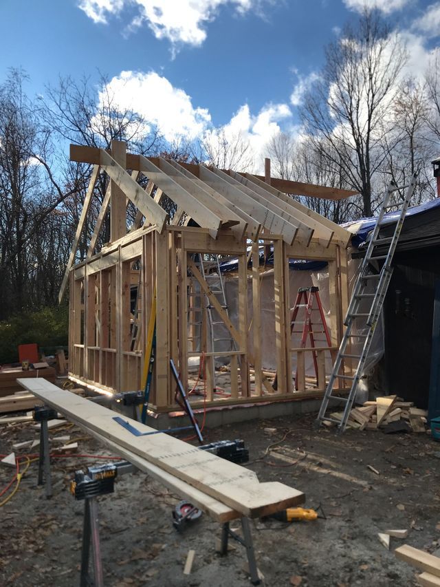 A house is being built with a ladder in the background.