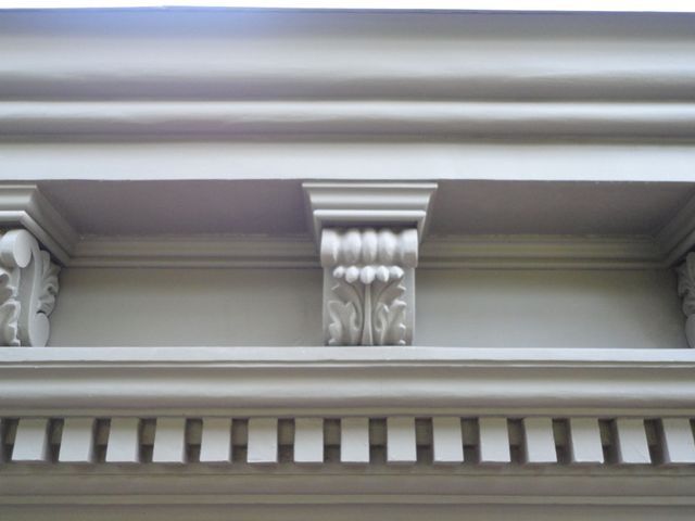 A close up of a building with a pillar on top of it