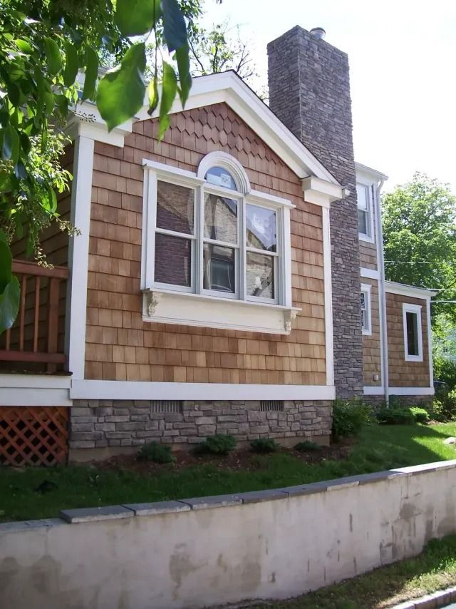 A house with a chimney on the side of it