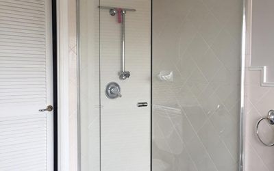 A Bathroom With A Shower Stall And A Toilet — All About Glass Lake Macquarie In Ellalong, NSW