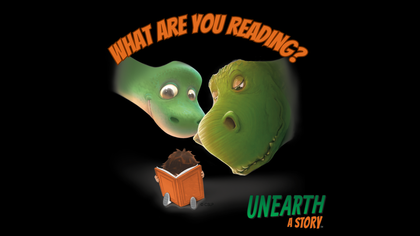 A black sign reads What Are You Reading? Unearth a Story. Two dinosaurs overlooking a child readint a b