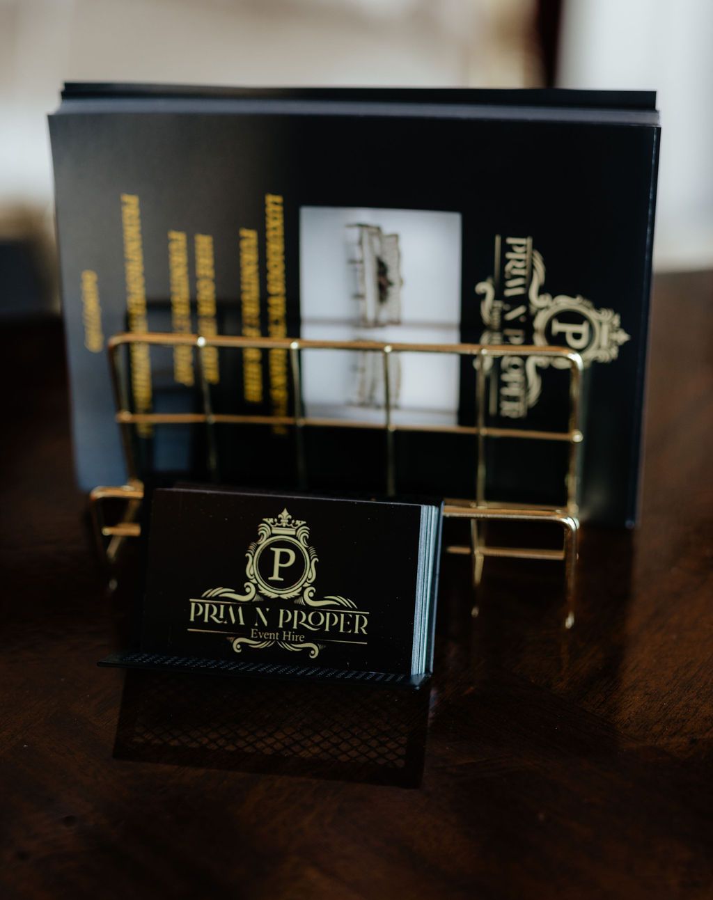 A Business Card Holder With the Letter P on It — Prim n Proper Event Hire in Palmview, QLD