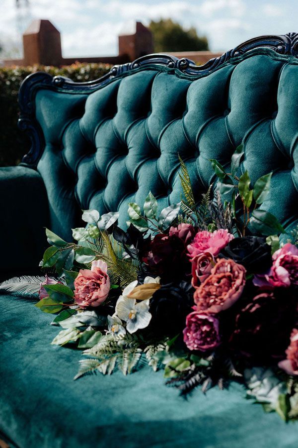 A Blue Couch With Pink Flowers on It — Prim n Proper Event Hire in Palmview, QLD