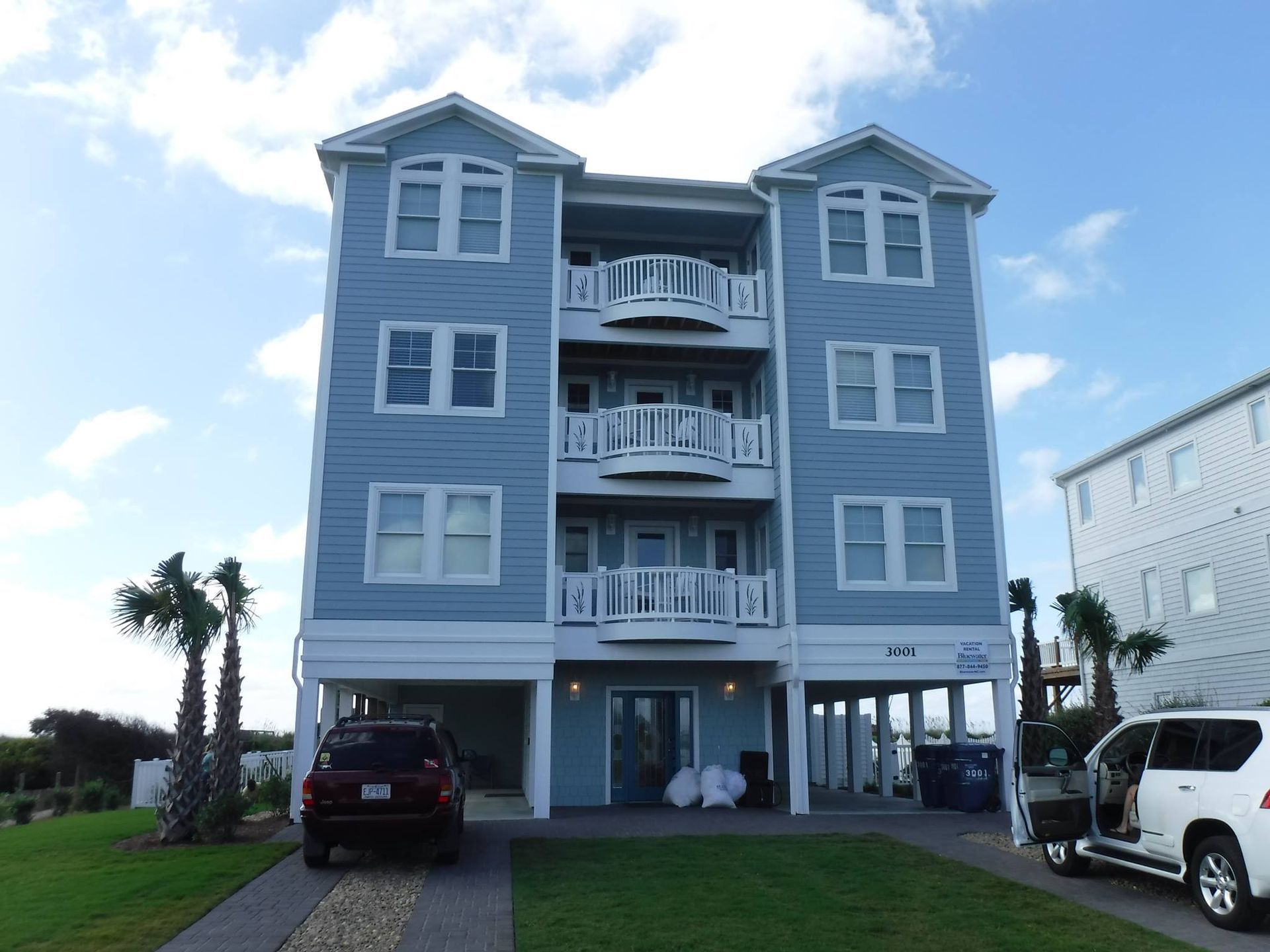 A wooden fence with a gate attached to it.