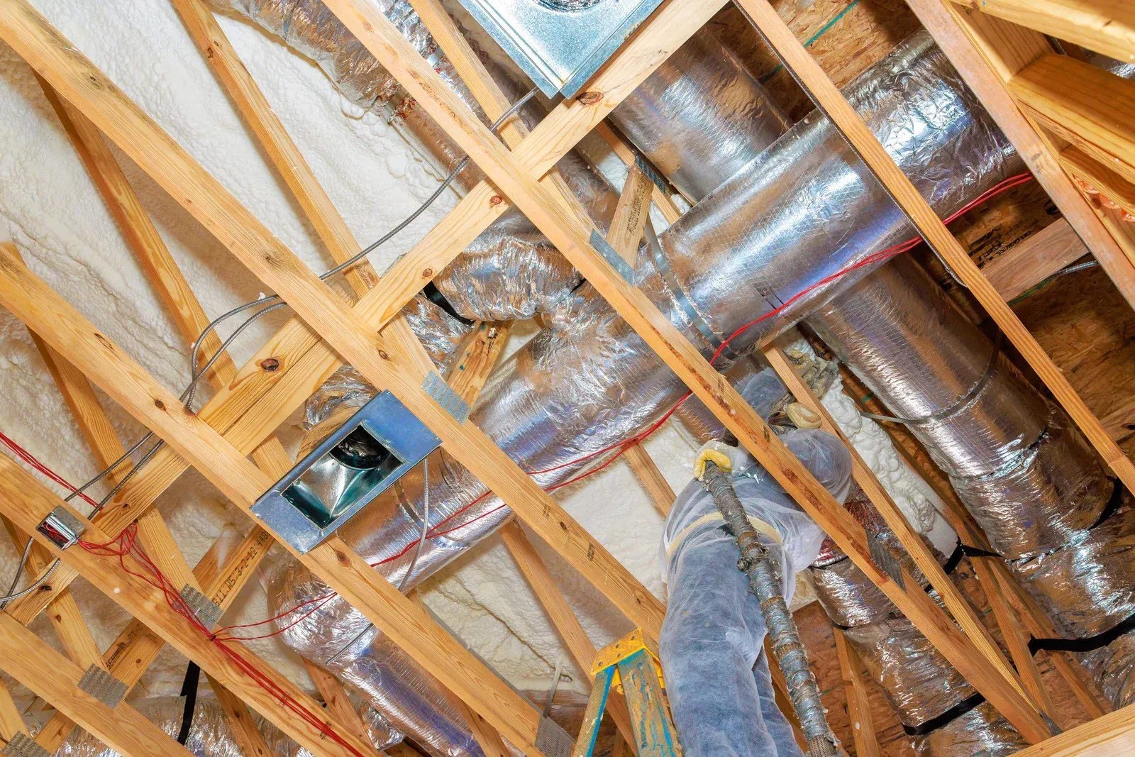 A wooden fence is sitting on top of a lush green field.