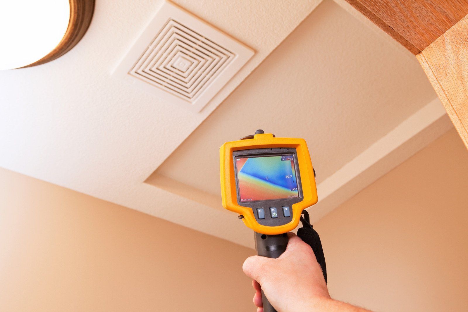 A wooden fence is sitting on top of a lush green field.