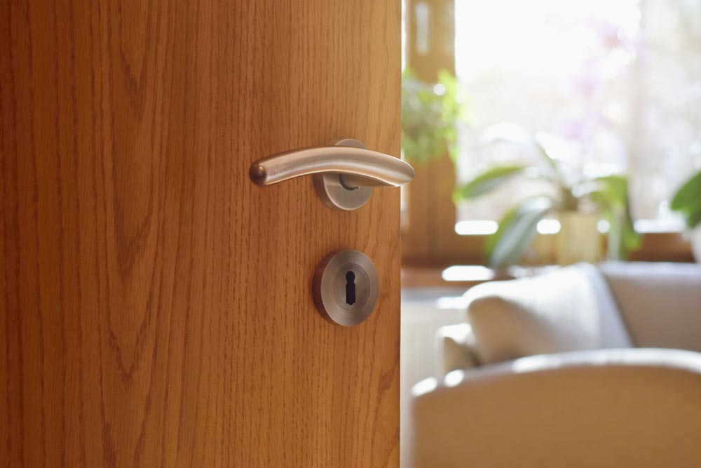 Half Opened Door And Beautiful Door Lock Handle — Coast 2 Coast Locksmiths in Buderim, QLD