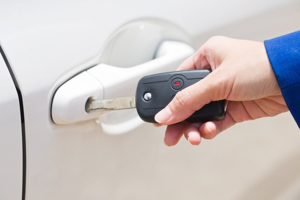 Opening A Car Door With New Key — Coast 2 Coast Locksmiths in Buderim, QLD
