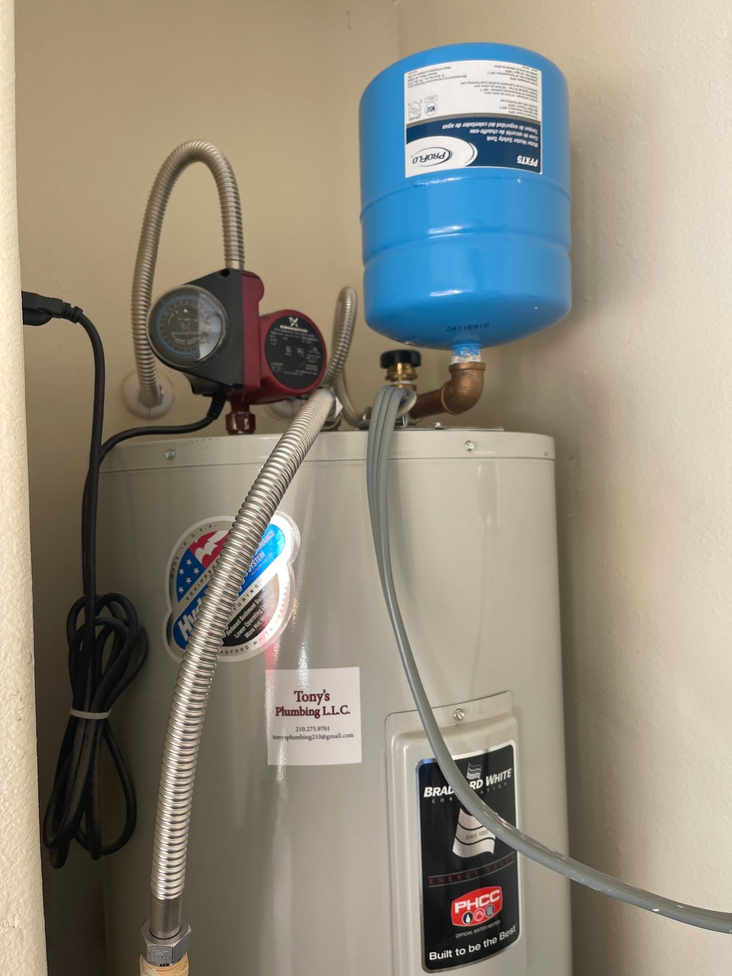 A water heater with a blue tank attached to it.
