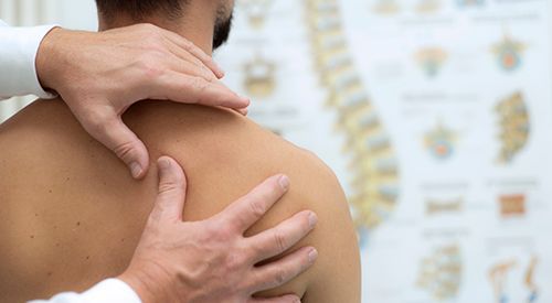 Medical check at the shoulder in a physiotherapy