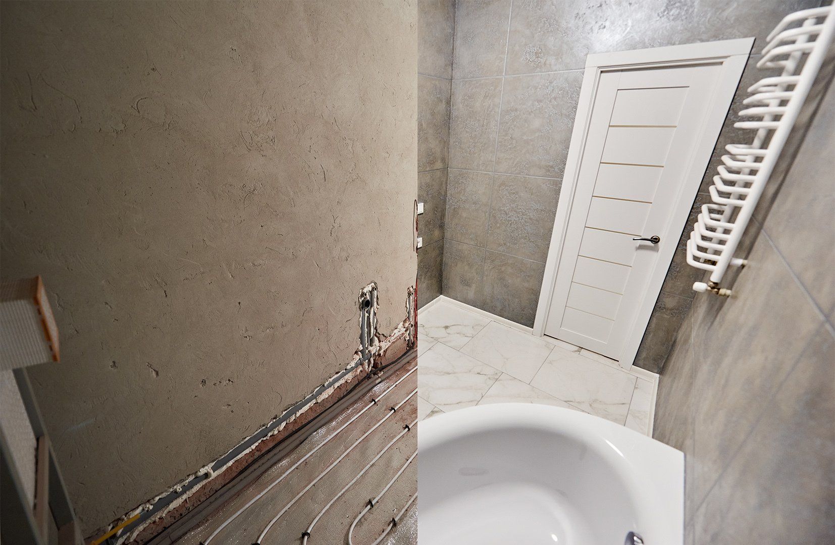 Modern bathroom with marble floor and white door before and after refurbishment. Comparison of old restroom with underfloor heating pipes and new bathroom with heated towel rail and while bathtub.