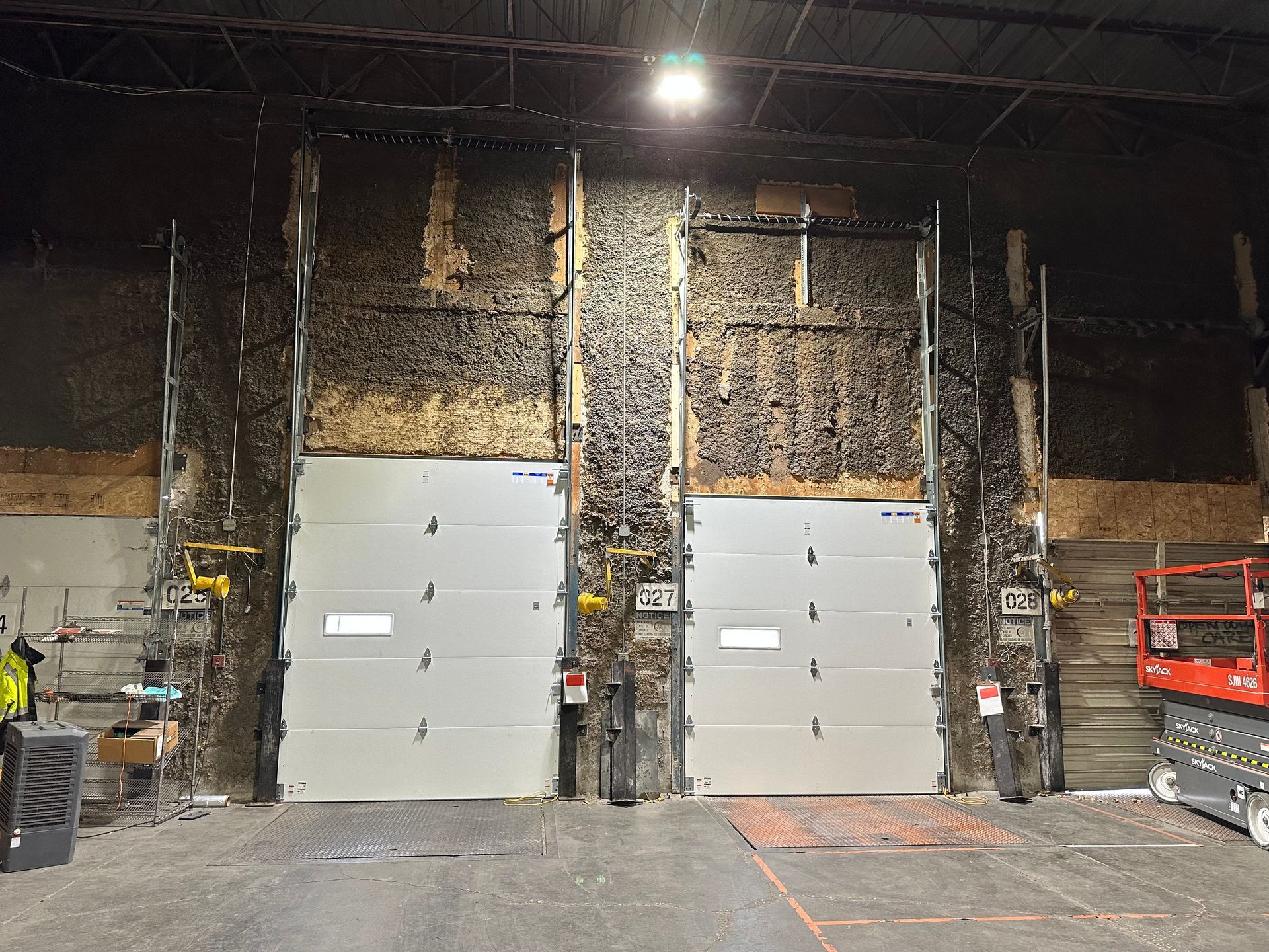 A warehouse with a lot of doors and stairs