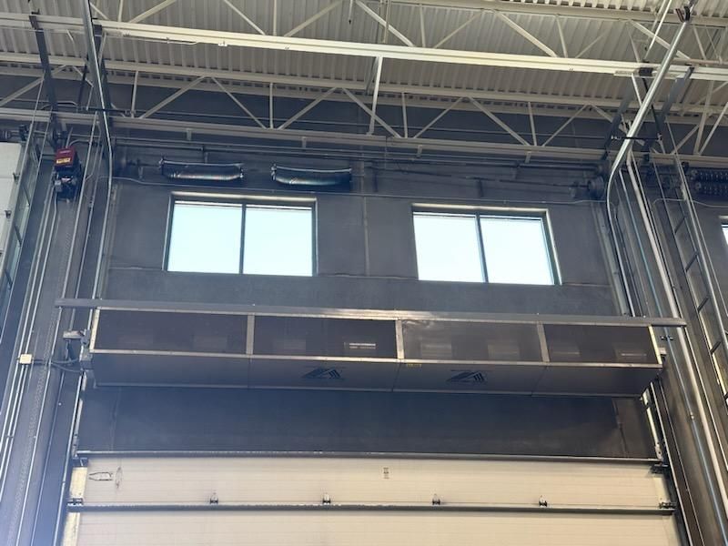 A large building with a lot of windows and a ceiling