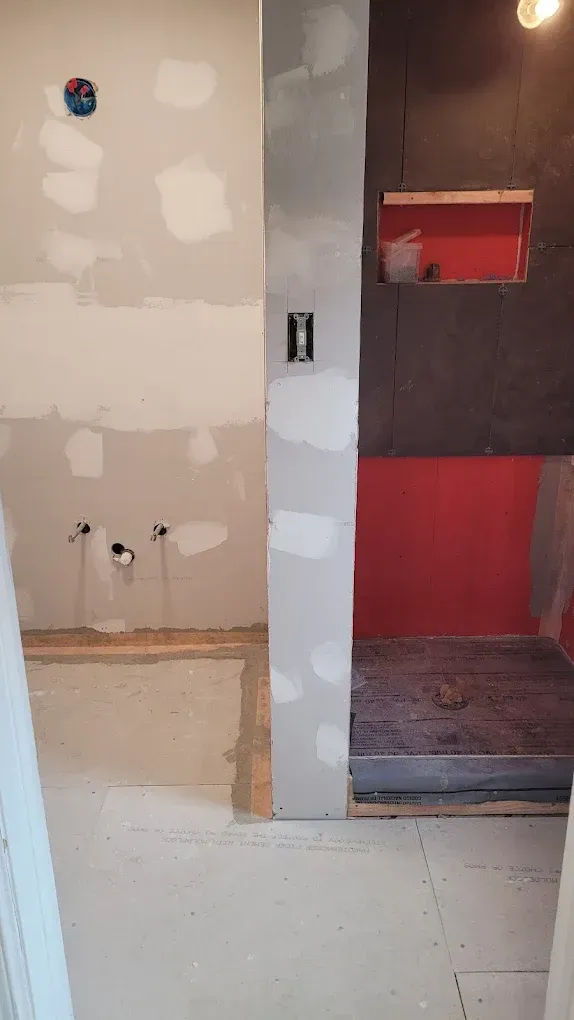 A bathroom is being remodeled and a shower is being built.