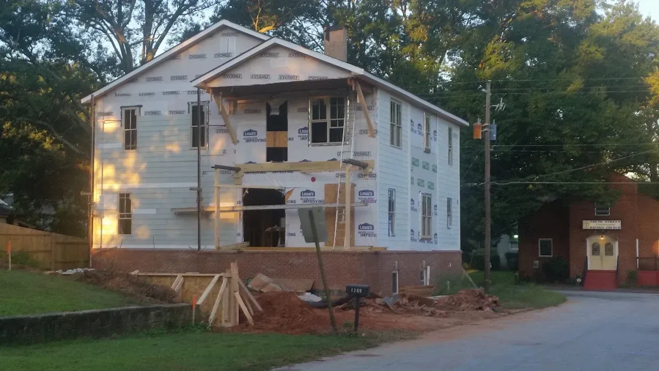 A house is being built on the side of the road.