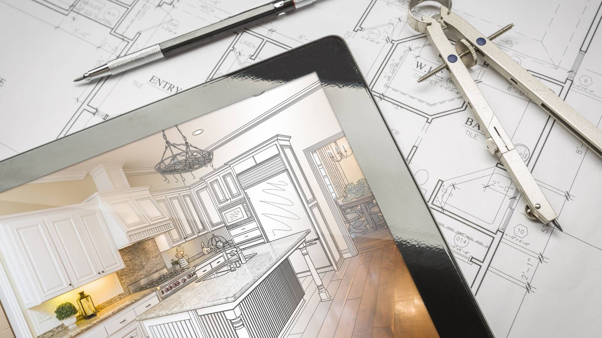 A tablet with a drawing of a kitchen on it.