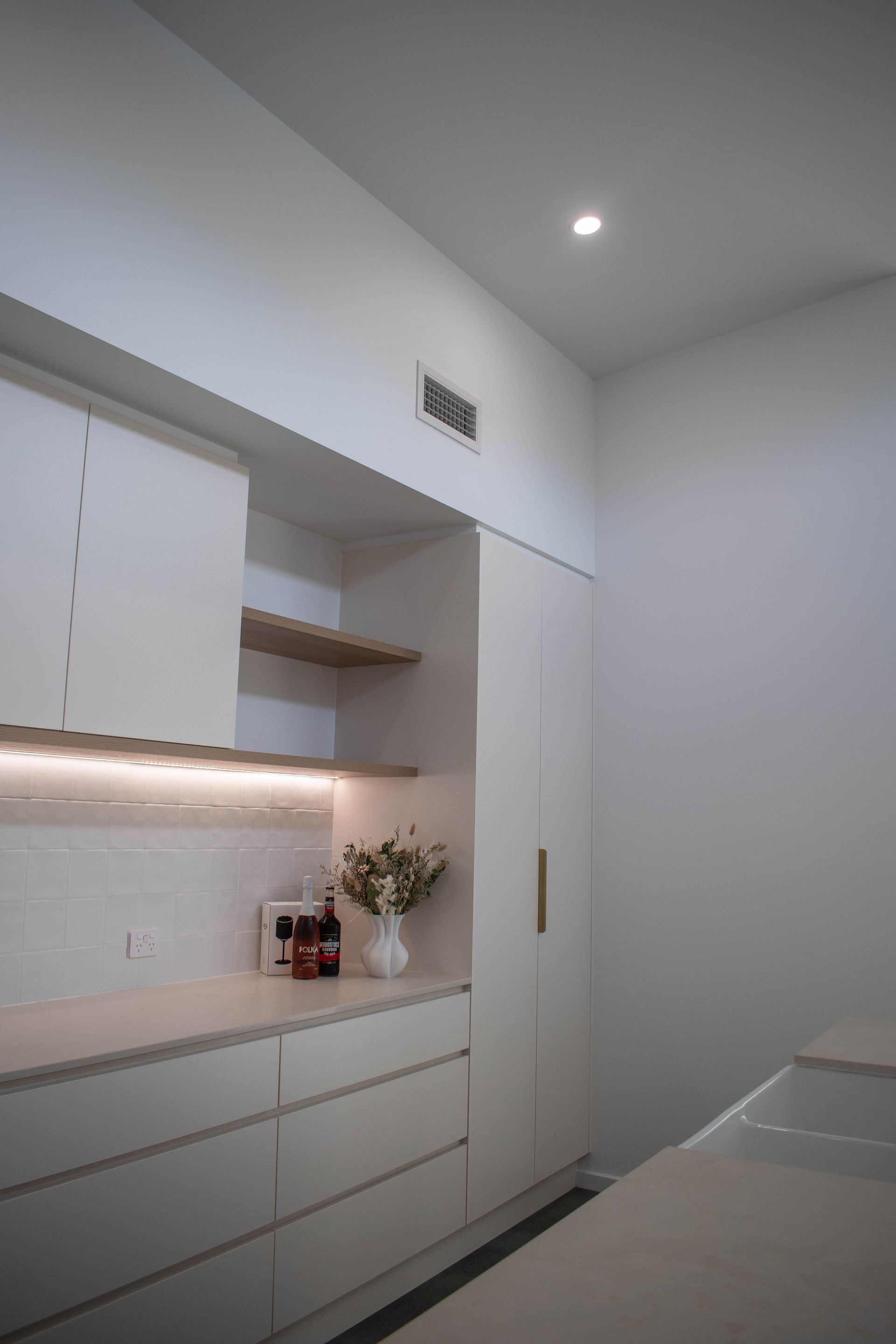 A Man is Working on a Security System With a Screwdriver — Anderson Electrical & Air in Taree, NSW