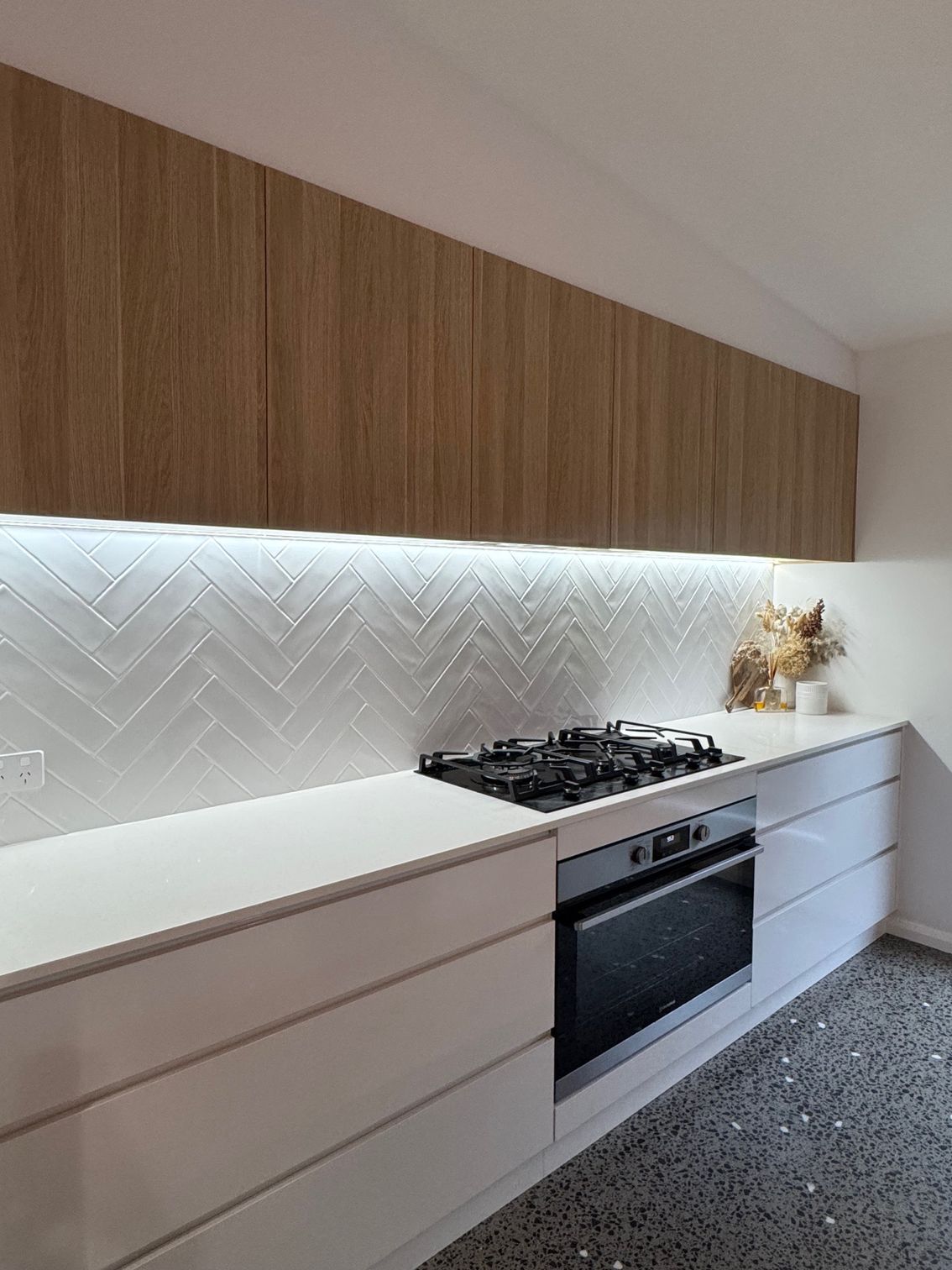 A Bunch of Yellow and Black Electric Tools Are on a Wooden Table — Anderson Electrical & Air in Taree, NSW