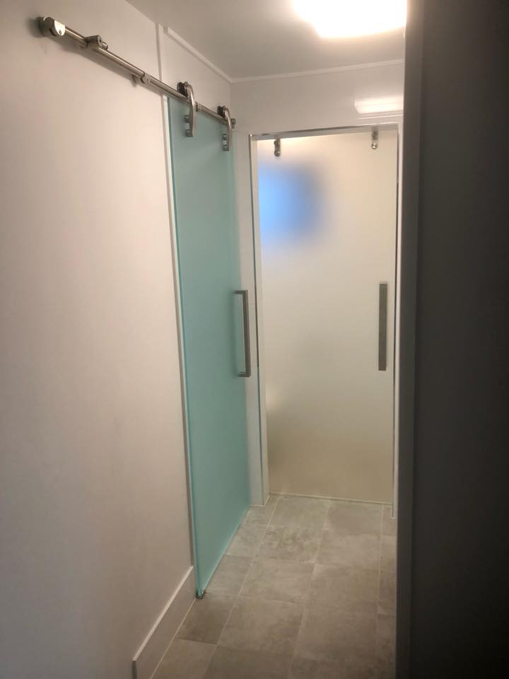 Frosted Bathroom Door — Glazing Service in Albion Park, NSW