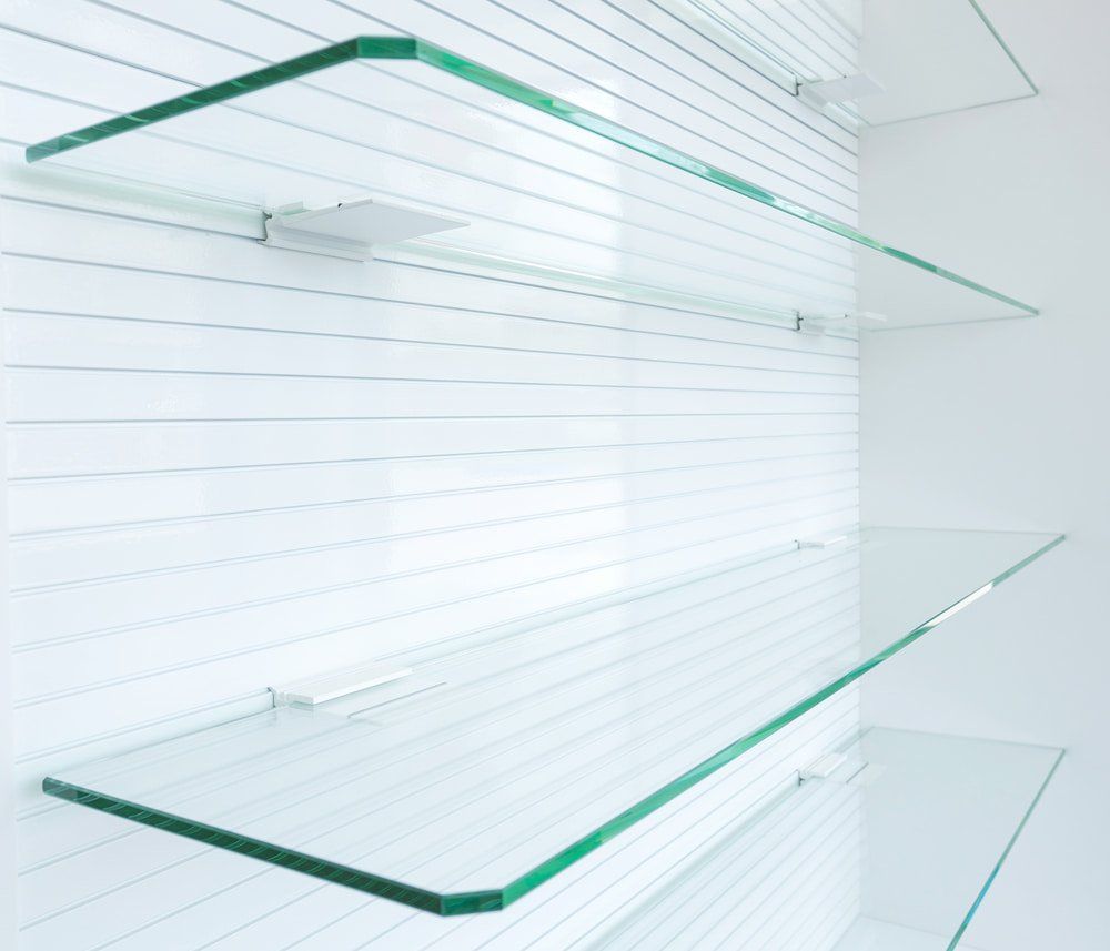 Empty Glass Shelves — Glazing Service in Albion Park, NSW