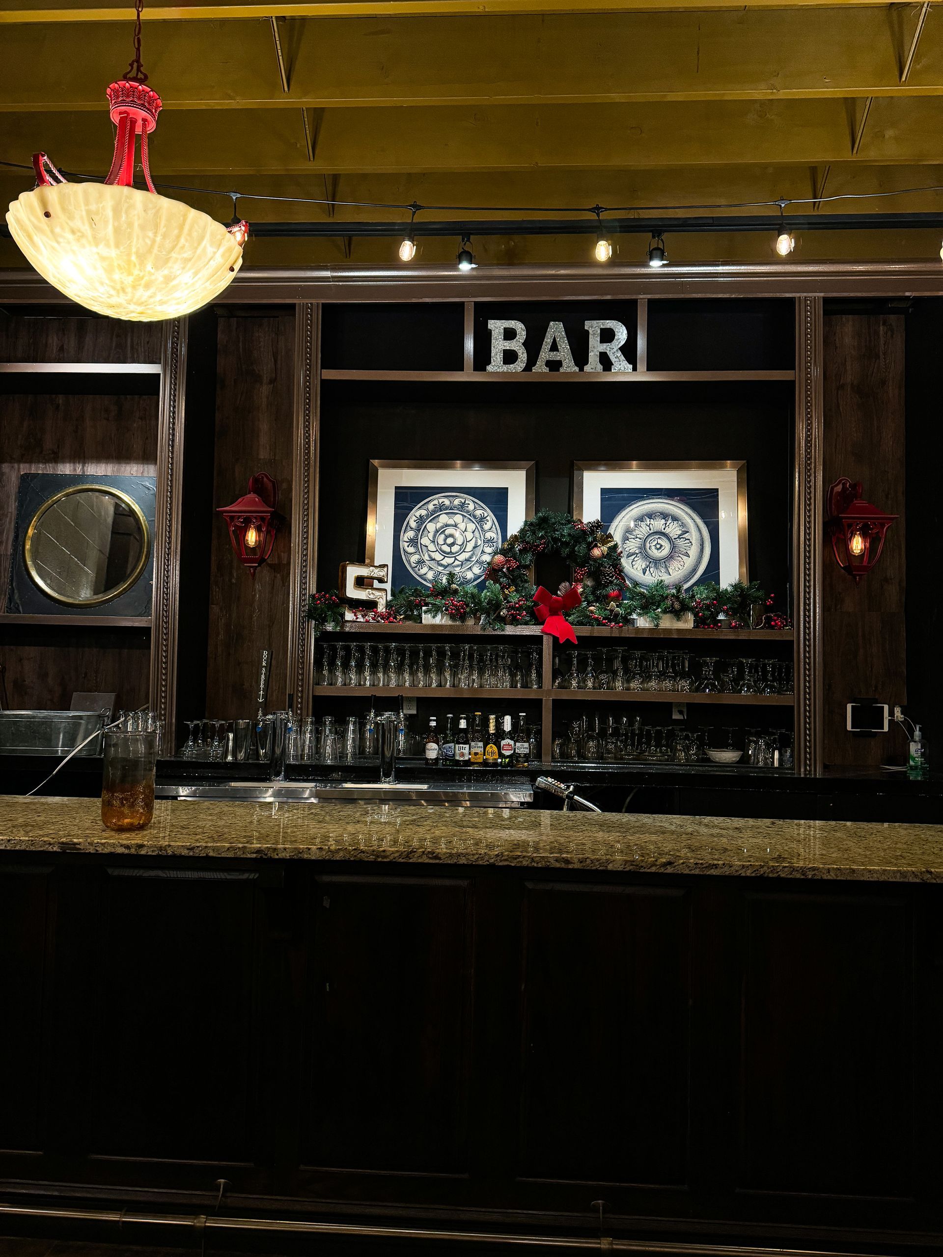 A bar with a sign that says bar on it