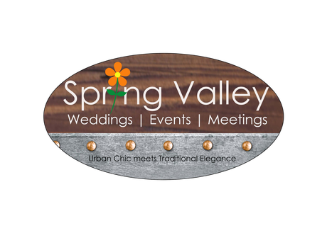 The logo for spring valley weddings events and meetings is a wooden sign with a flower on it.