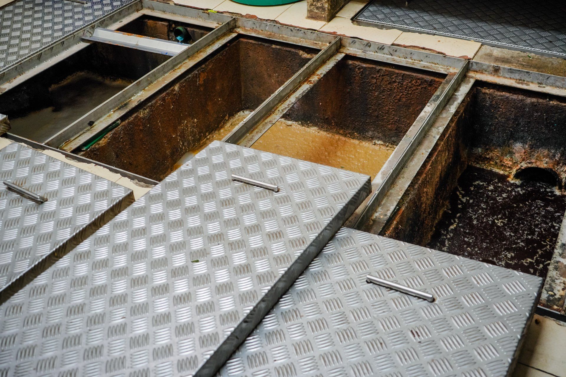 dirty grease traps that need cleaning