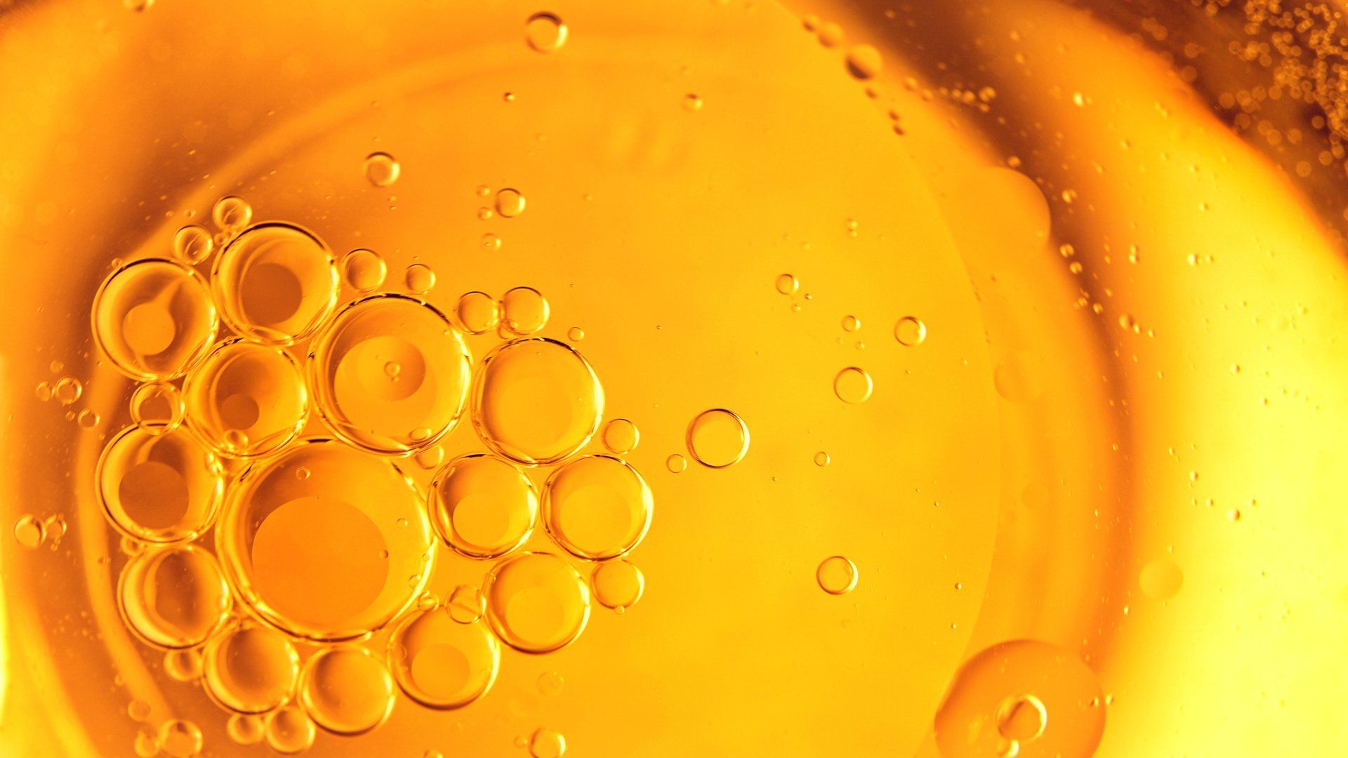 close up of fryer oil bubbles and golden clear