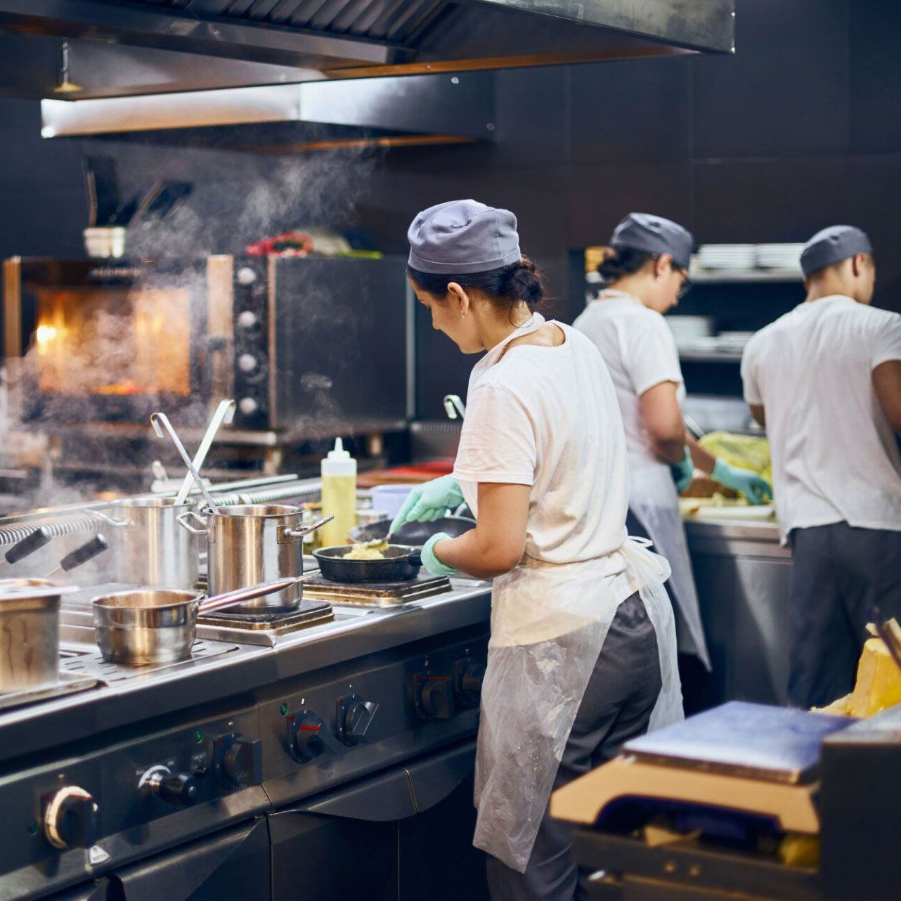 chef cooking in a commercial kitchen in Atlanta with clean grease trap