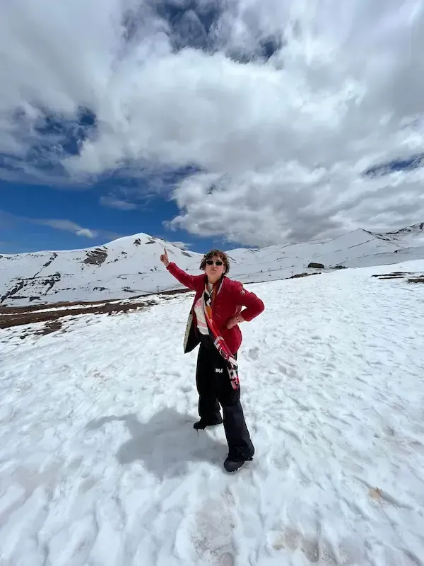 A woman at the snow in Los Andes tour by ChileVive Tours