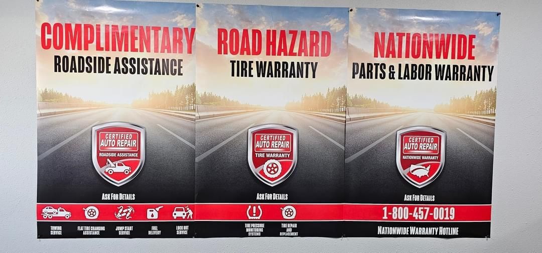 Three posters for complimentary roadside assistance road hazard tire warranty and nationwide paints and labor warranty