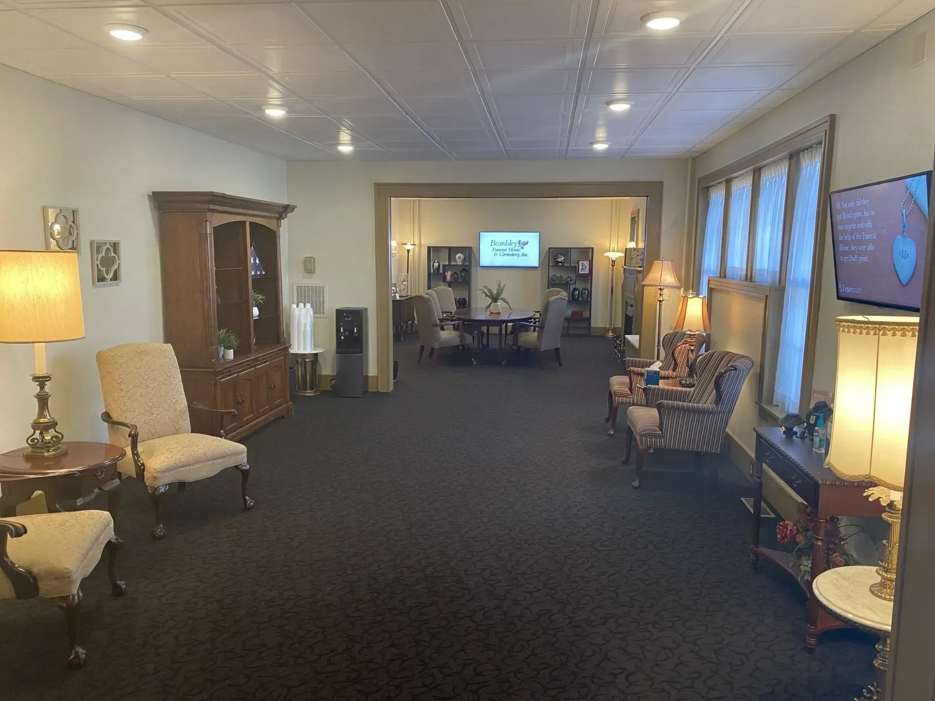A living room filled with furniture and a television.