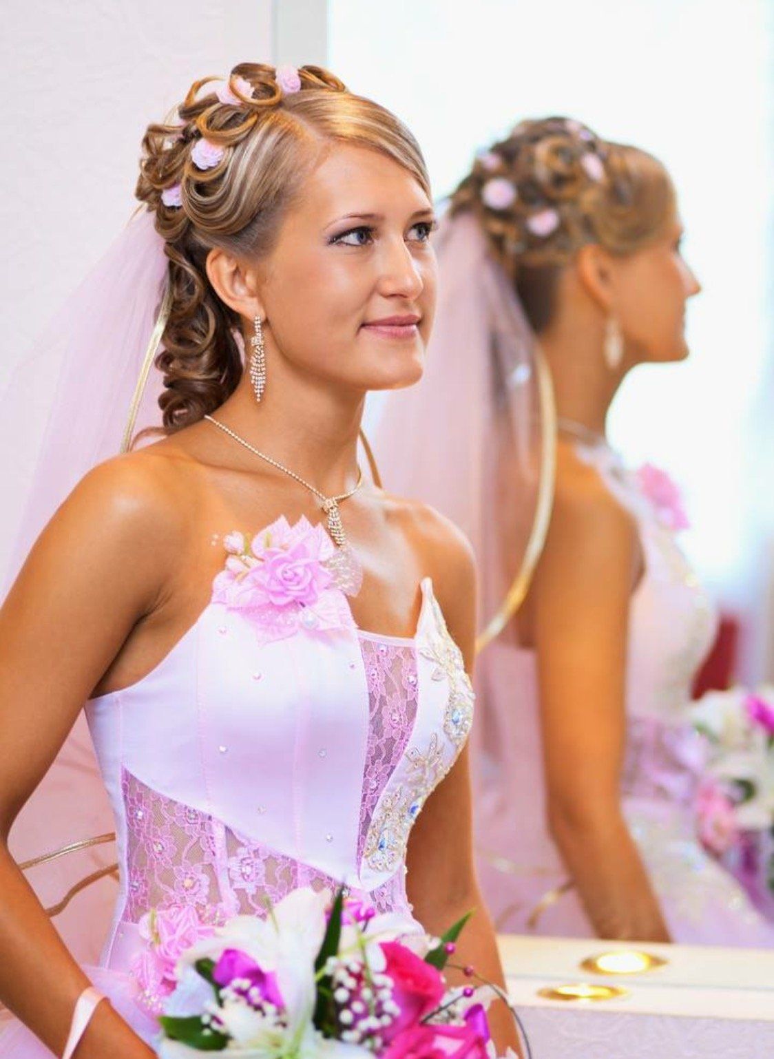 bride next to a mirror