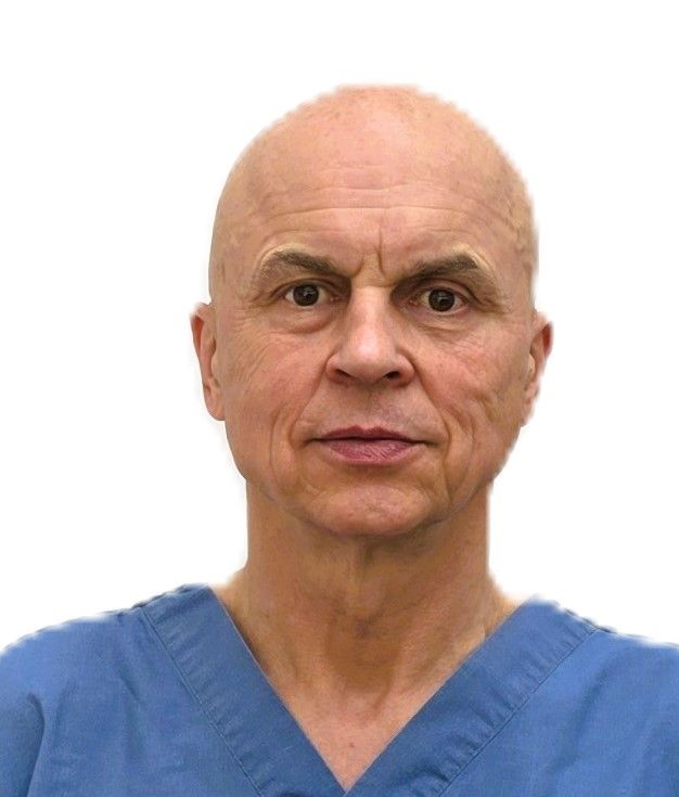 A bald man wearing a black shirt is smiling for the camera.