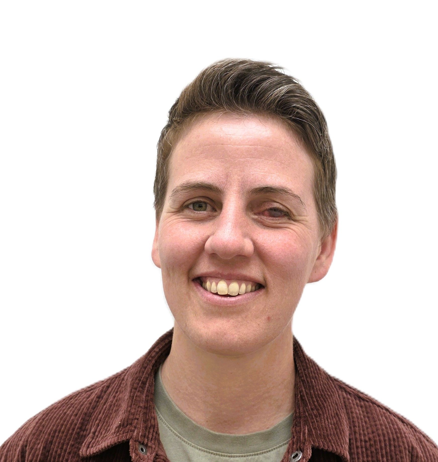 A woman in a plaid shirt is smiling for the camera.