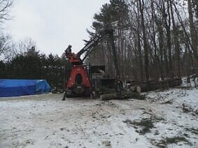 Lot and Land Management — Man Cutting Tree Logs in Colchester, VT
