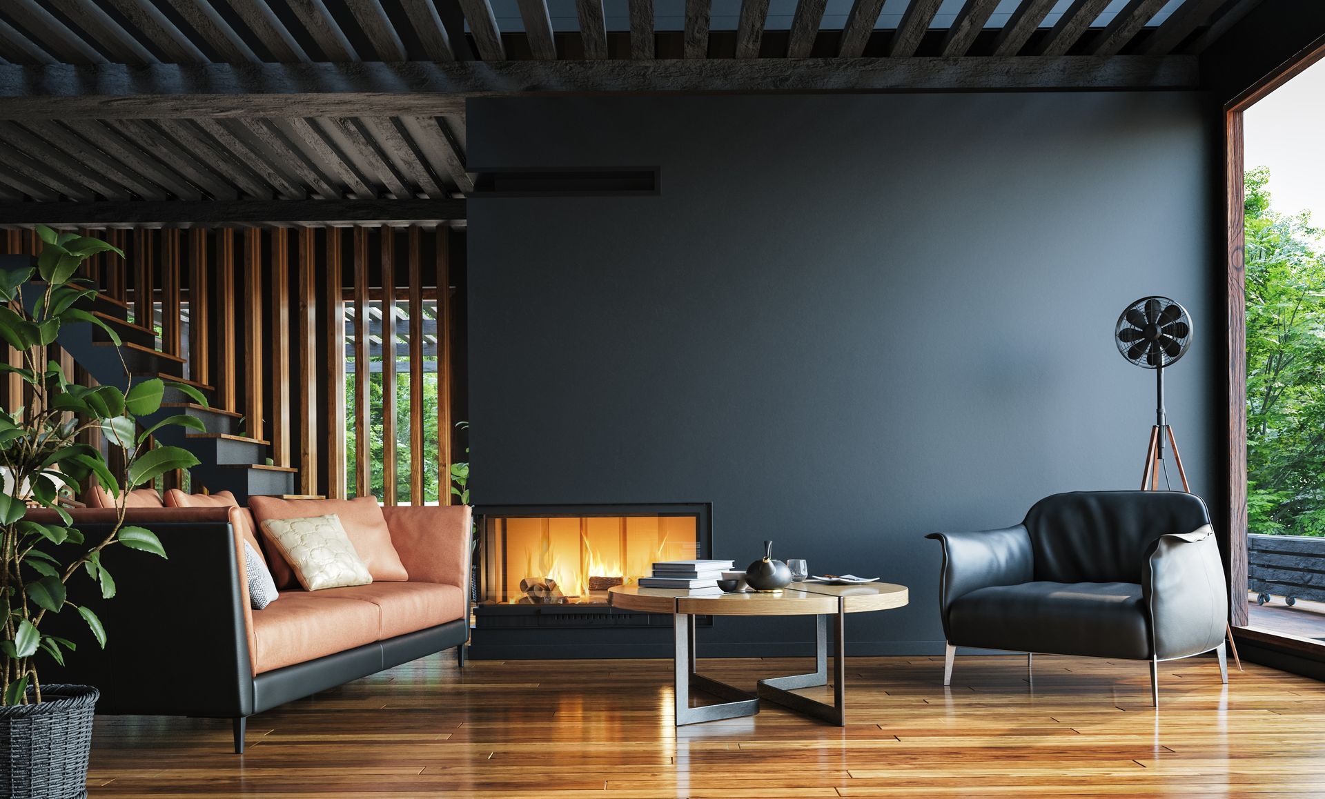 Modern living room with fireplace, black and tan sofas, coffee table, and wooden floor