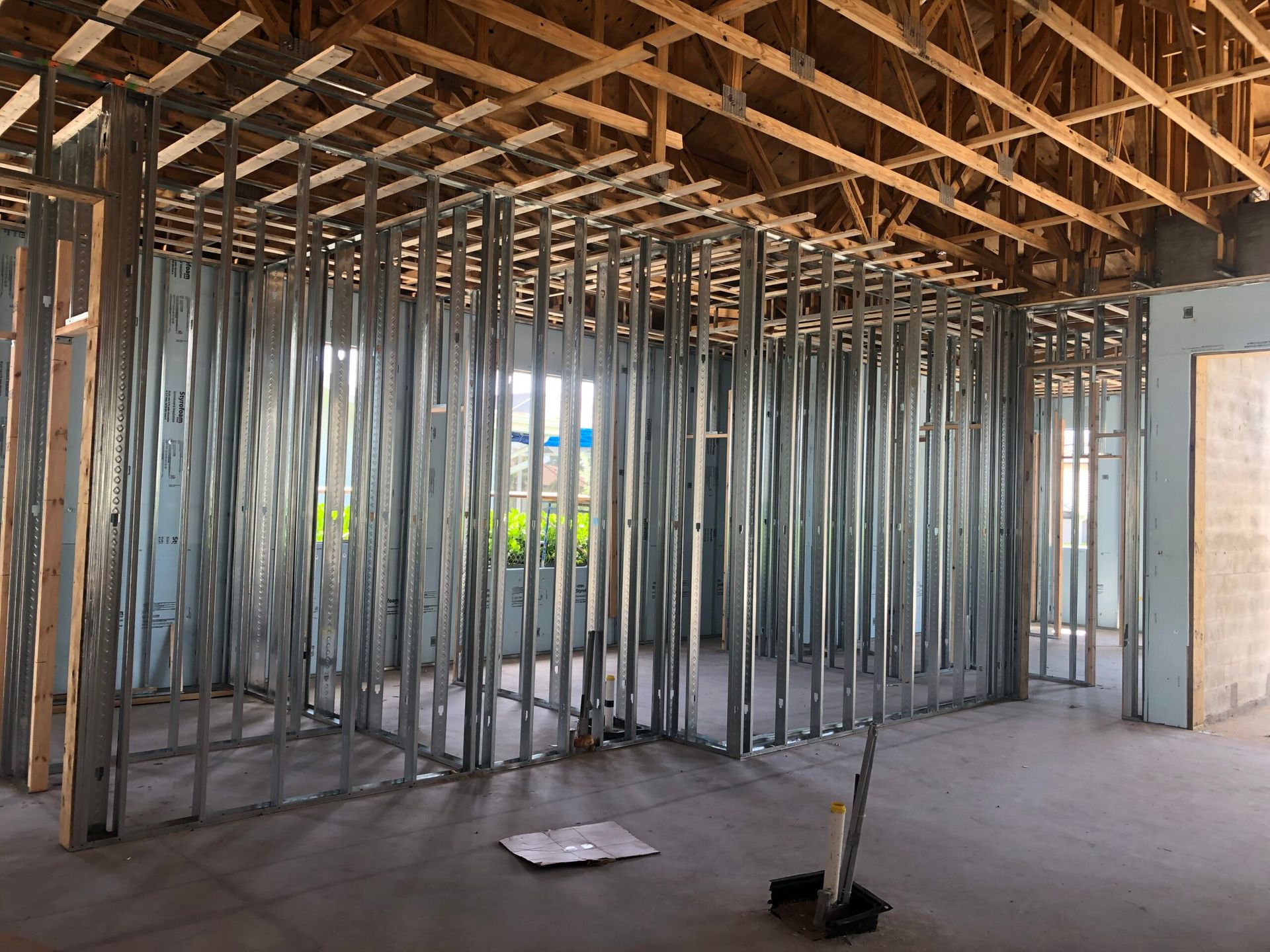 A room under construction with a lot of metal frames.