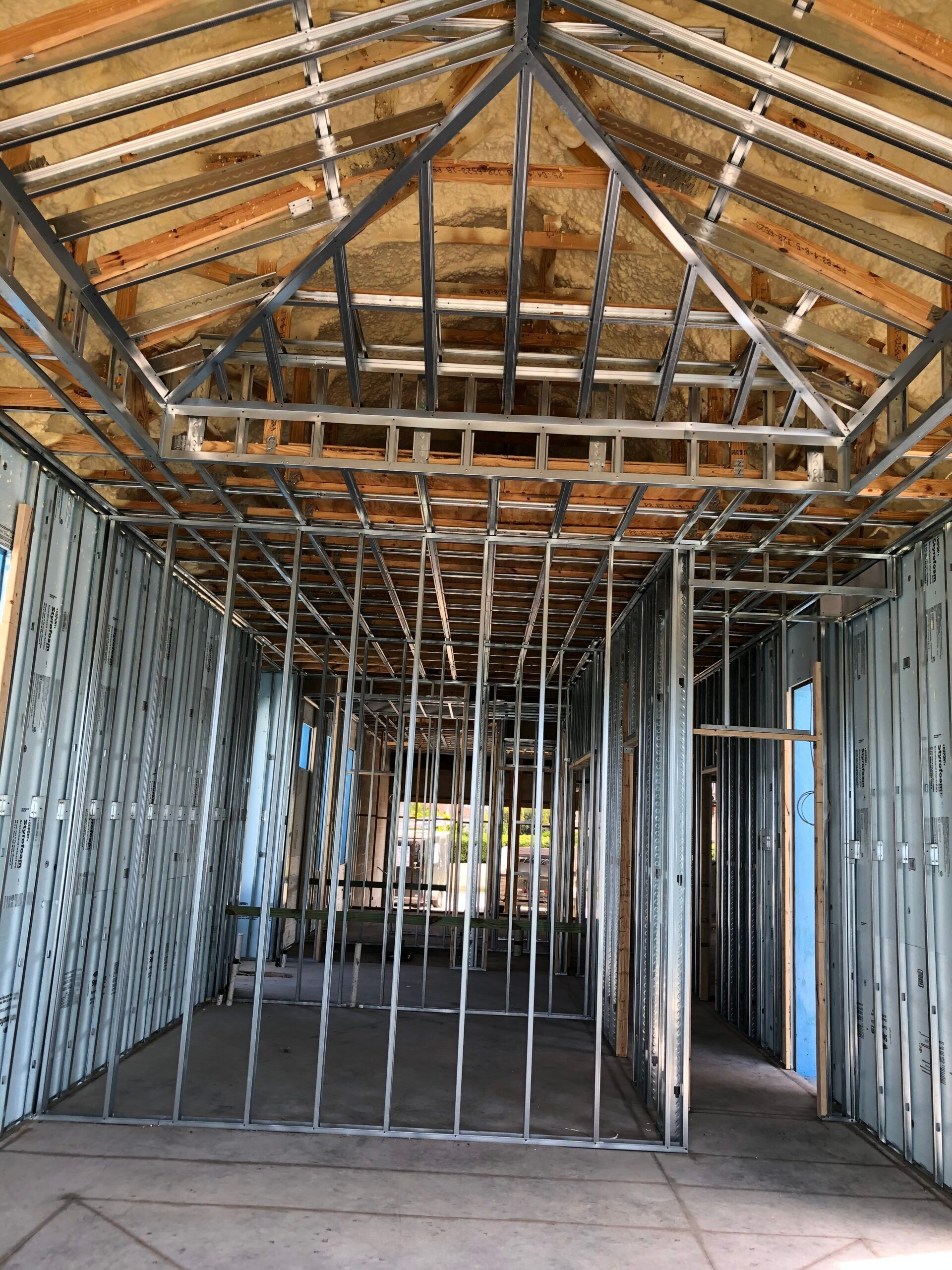 The inside of a building under construction with a metal frame.