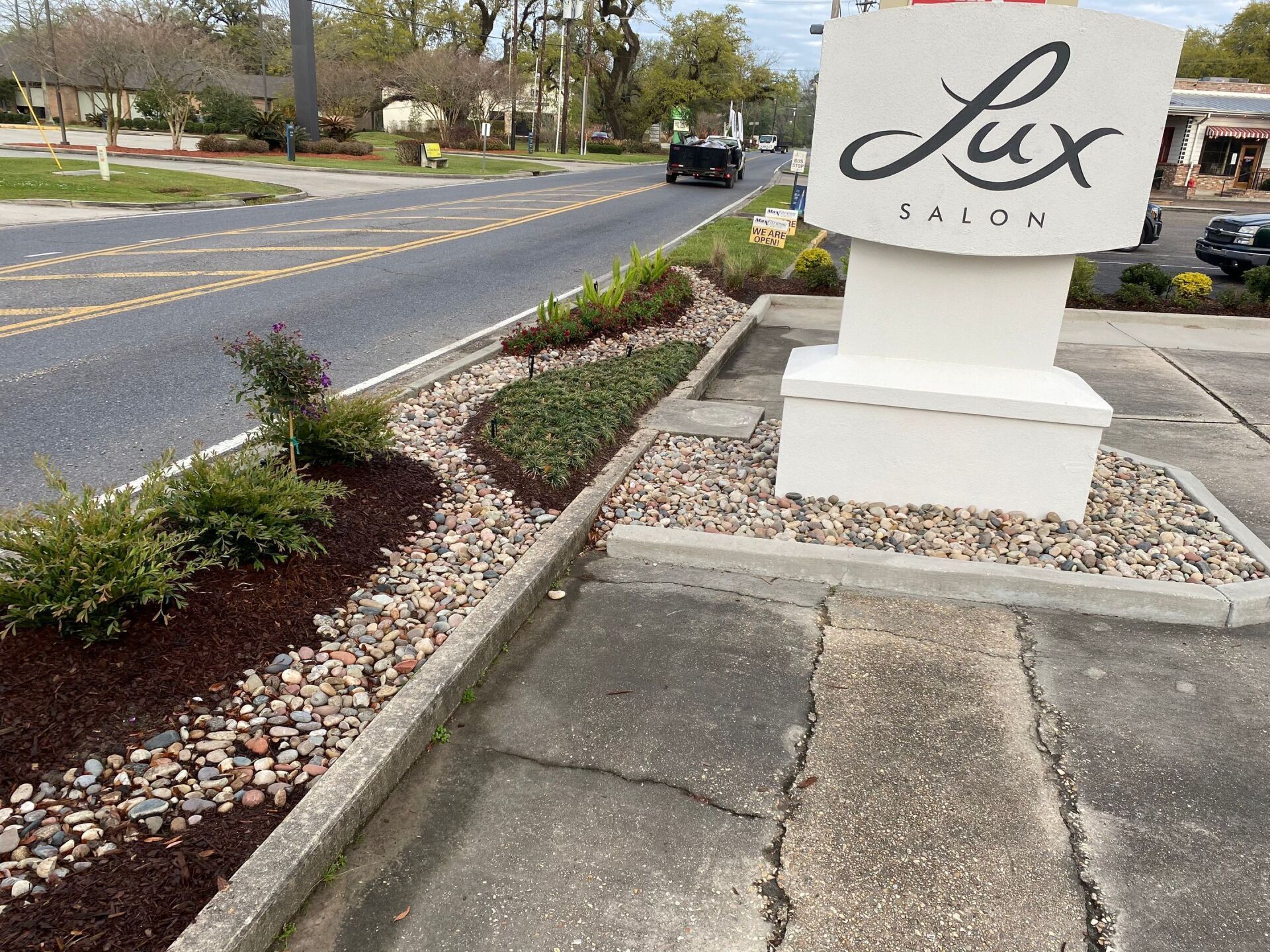 A large white sign that says lux on it