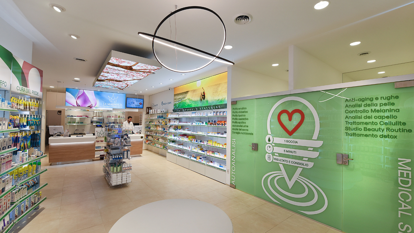 A pharmacy with a green wall and a red heart on it.