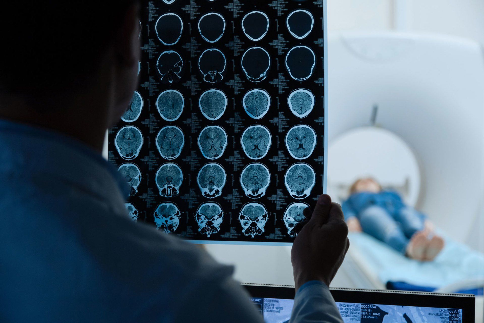 Licensed Neurologist — MRI Scan Images Being Examined By a Doctor in Merritt Island, FL