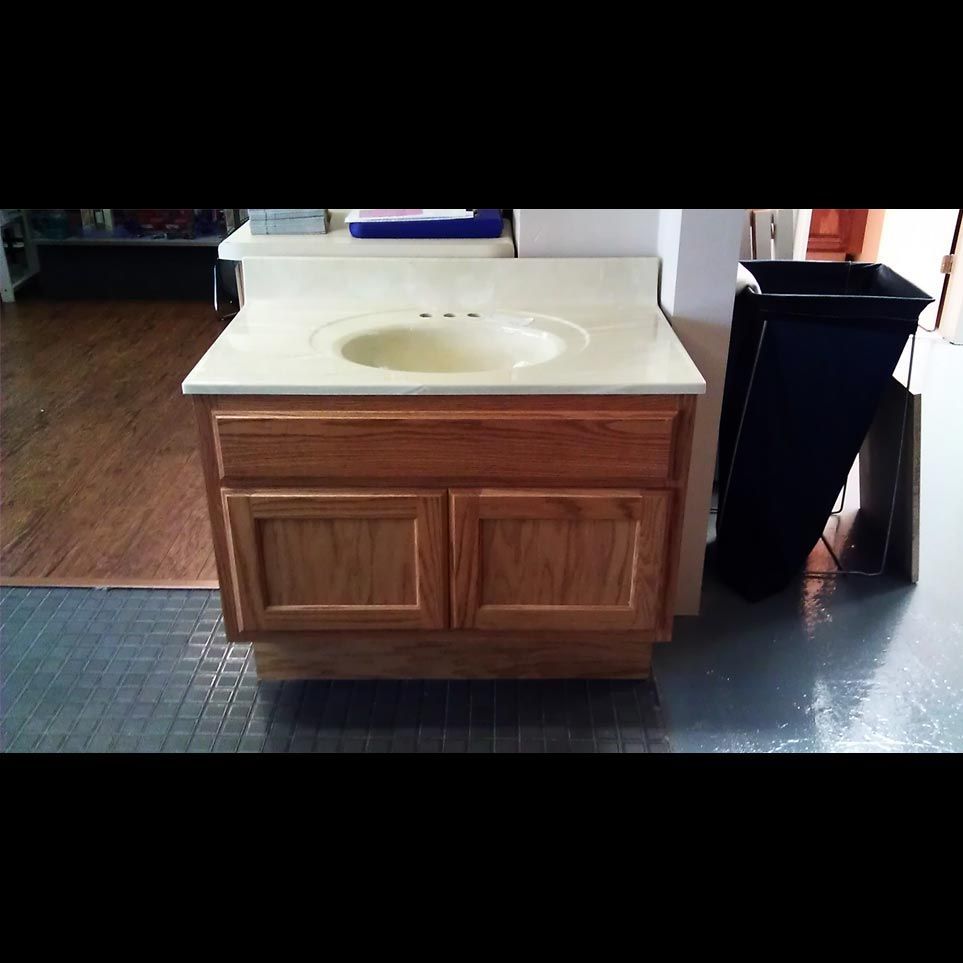 A bathroom vanity with a sink on top of it