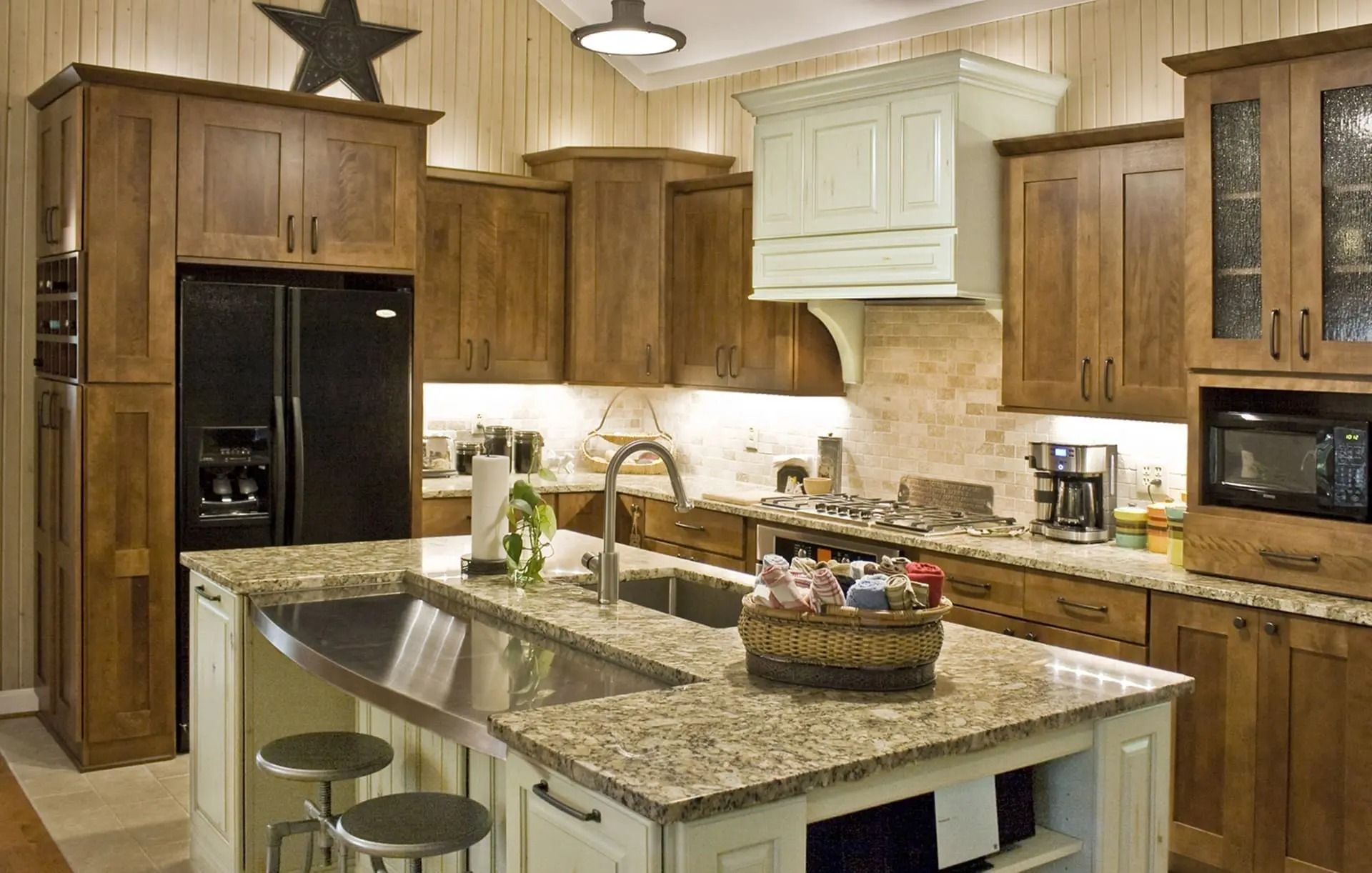 A kitchen with stainless steel appliances and granite counter tops