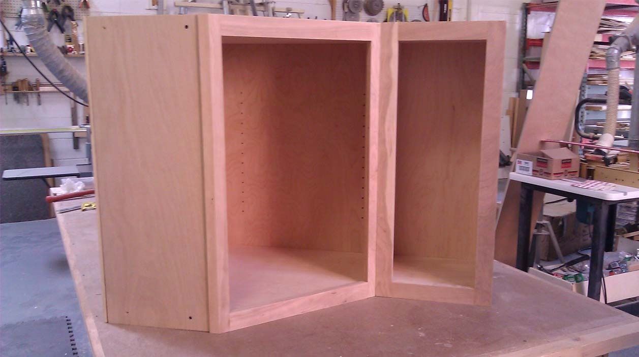 Two wooden boxes are sitting on top of a wooden table.