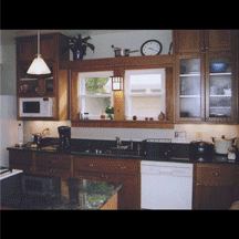 A kitchen with wooden cabinets and a white dishwasher