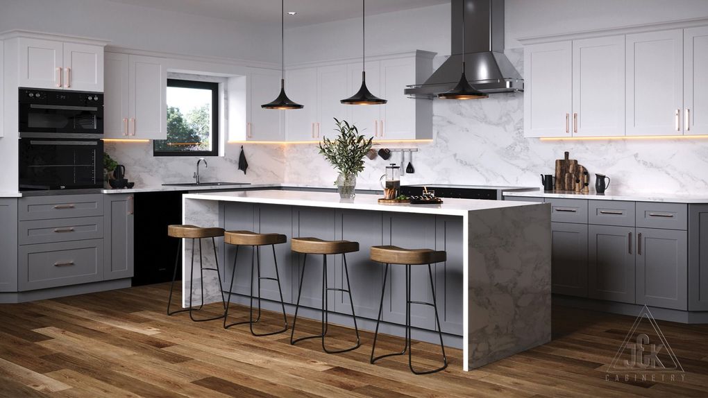 A kitchen with white cabinets and a large island with stools.
